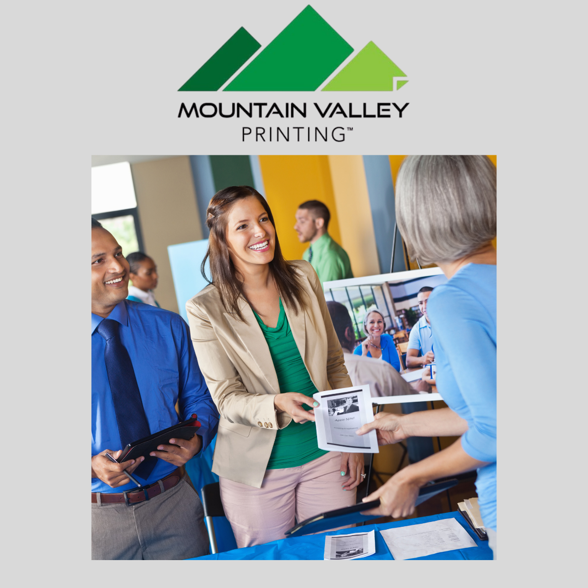 3 An expert at Mountain Valley Printing showing printed marketing materials